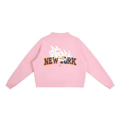 Pink cropped hoodie with Bronx New York graffiti graphic, bold streetwear style