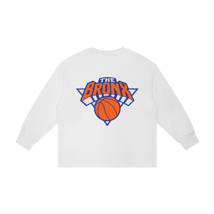 White long sleeve tee with 'The Bronx' basketball graphic, bold streetwear design inspired by NYC culture
