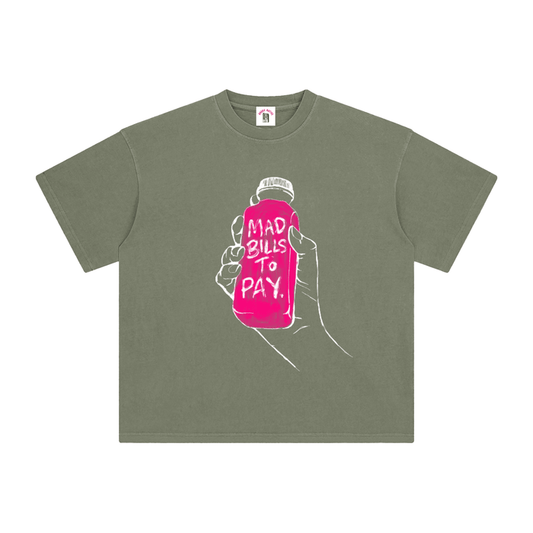 Green t-shirt with a graphic of a hand holding a pink bottle labeled 'Mad Bills to Pay' on a white background.